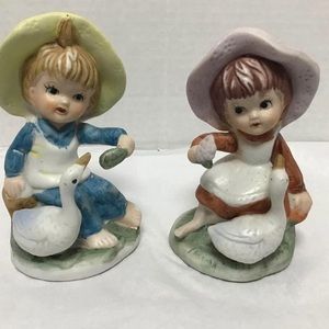Vintage boy and girl with ducks figurine size around 3 inches.